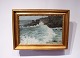 Oil painting with motif of crashing waves on a danish beach and with a gilded frame. 5000m2 showroom.