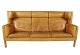 Three seater sofa, model Kupe, by Børge Mogensen and upholstered with light 
cognac colored leather.
5000m2 showroom.