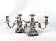 A set of two armed candlesticks of hallmarked silver.5000m2 showroom.