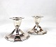 A pair of edged candlesticks of hallmarked silver.5000m2 showroom.