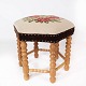 Stool of light wood and upholstered with embroidered fabric from the 1970s.
5000m2 showroom.
