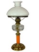 Kerosene lamp of brass with white opaline glass shade and orange glass stem, 
from around the 1860s. 
Great condition
